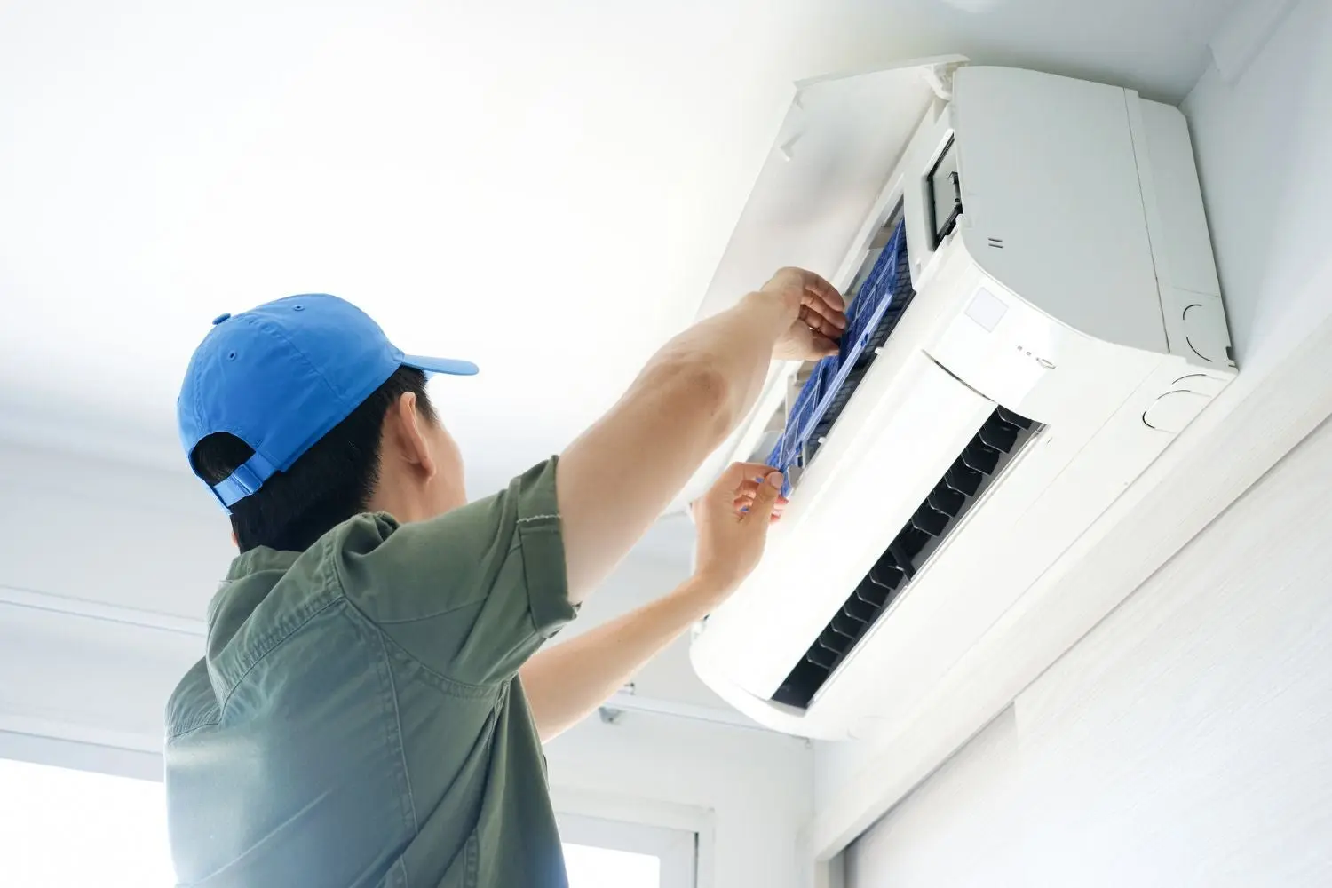 Technician repairing AC unit